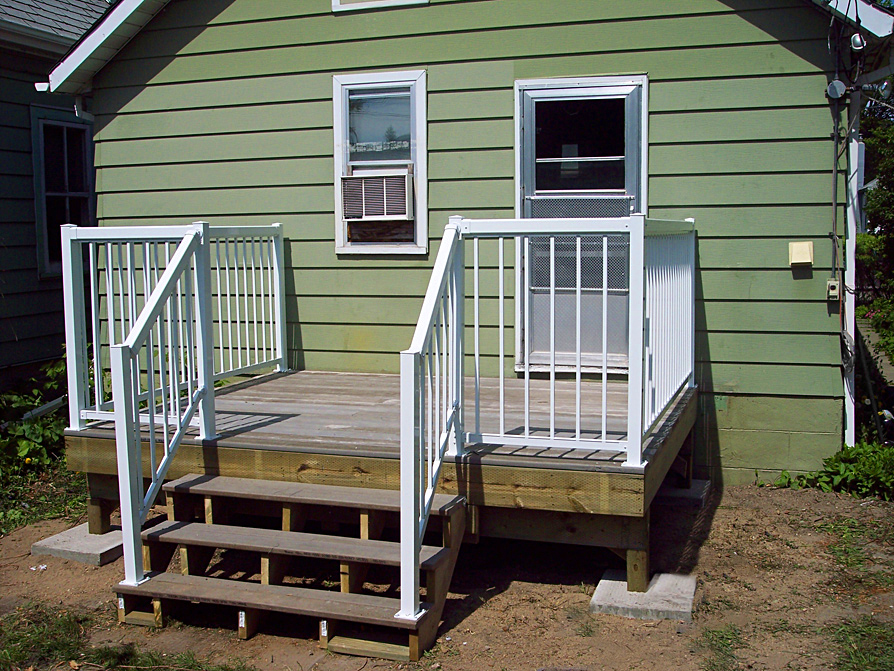 Wooden deck with white railings